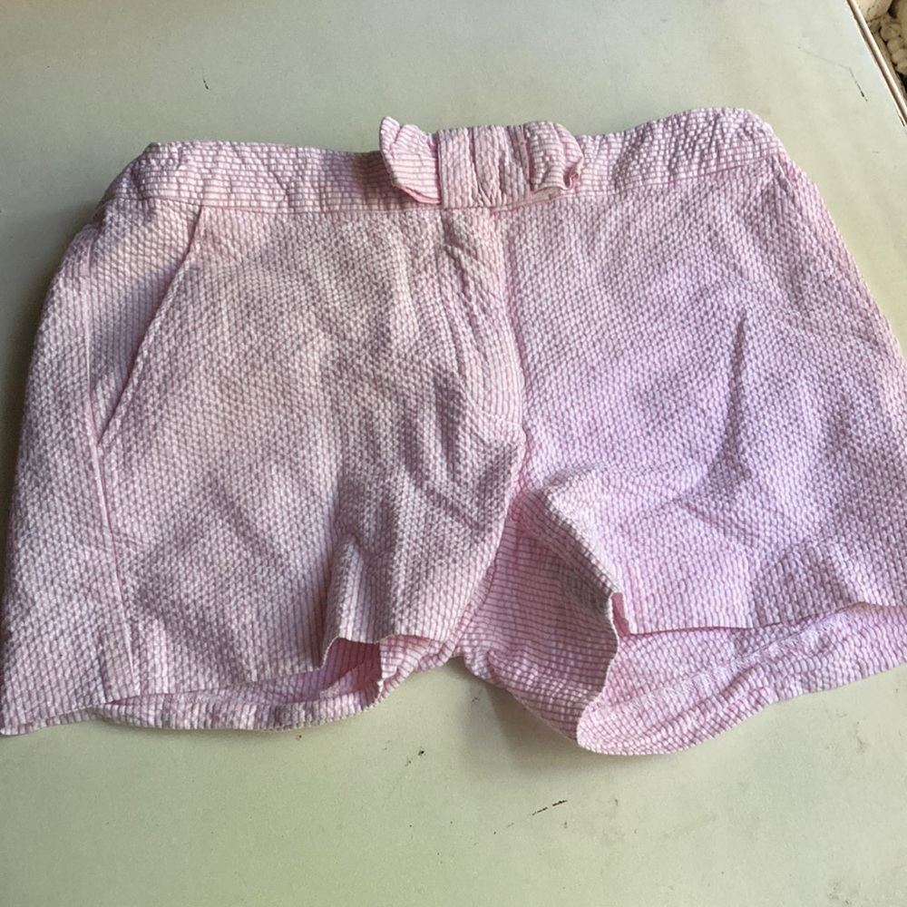 Pink and white CrewCuts shorts with pockets on the front and the back